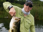 Warren Prior with his personal best bass on fly