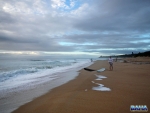 A surfer getting ready for a morning session