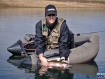 Warren releasing a trout