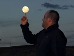 Nick playing with the moon