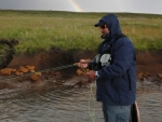 Nick fishing under a rainbow