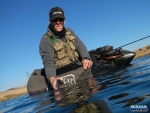 Warren Prior releasing a fish