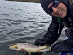 Warren releasing a brown trout